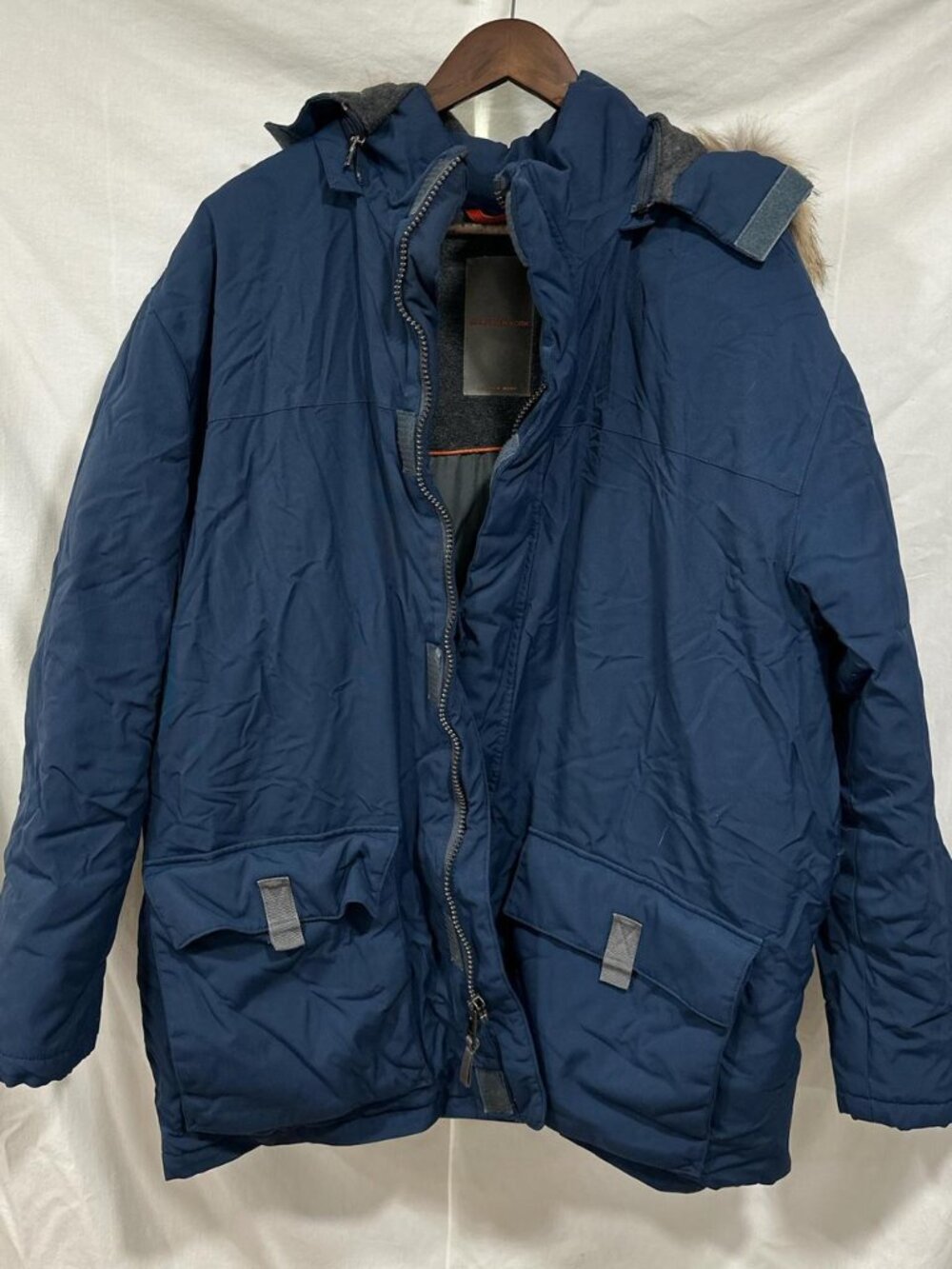 Blue and grey puffer jacket with removable fur trim hood